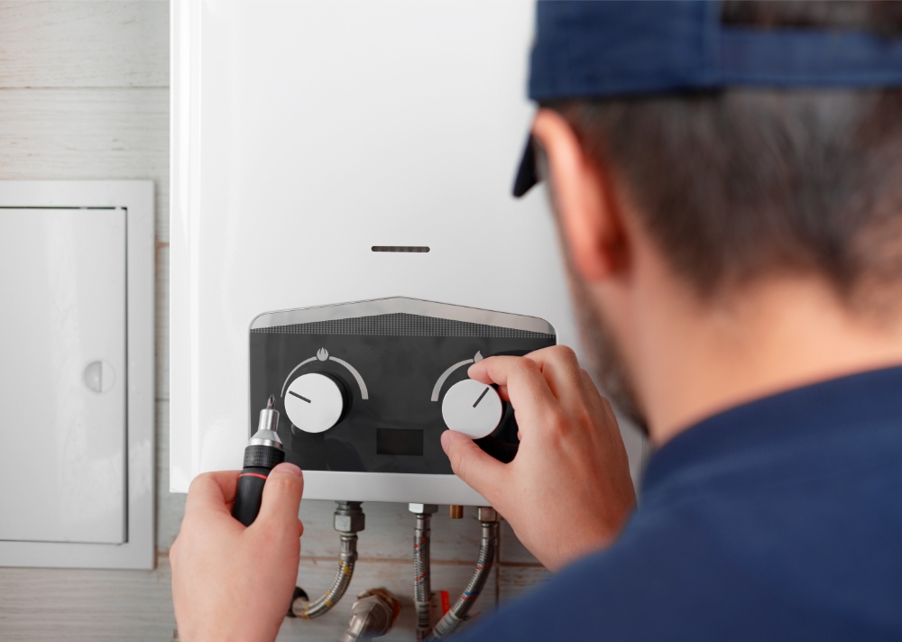 Person adjusting heater controls