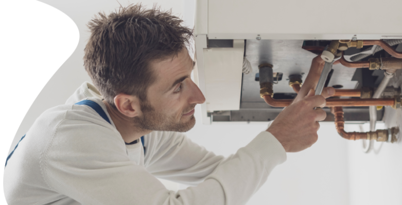 Plumber working on pipes